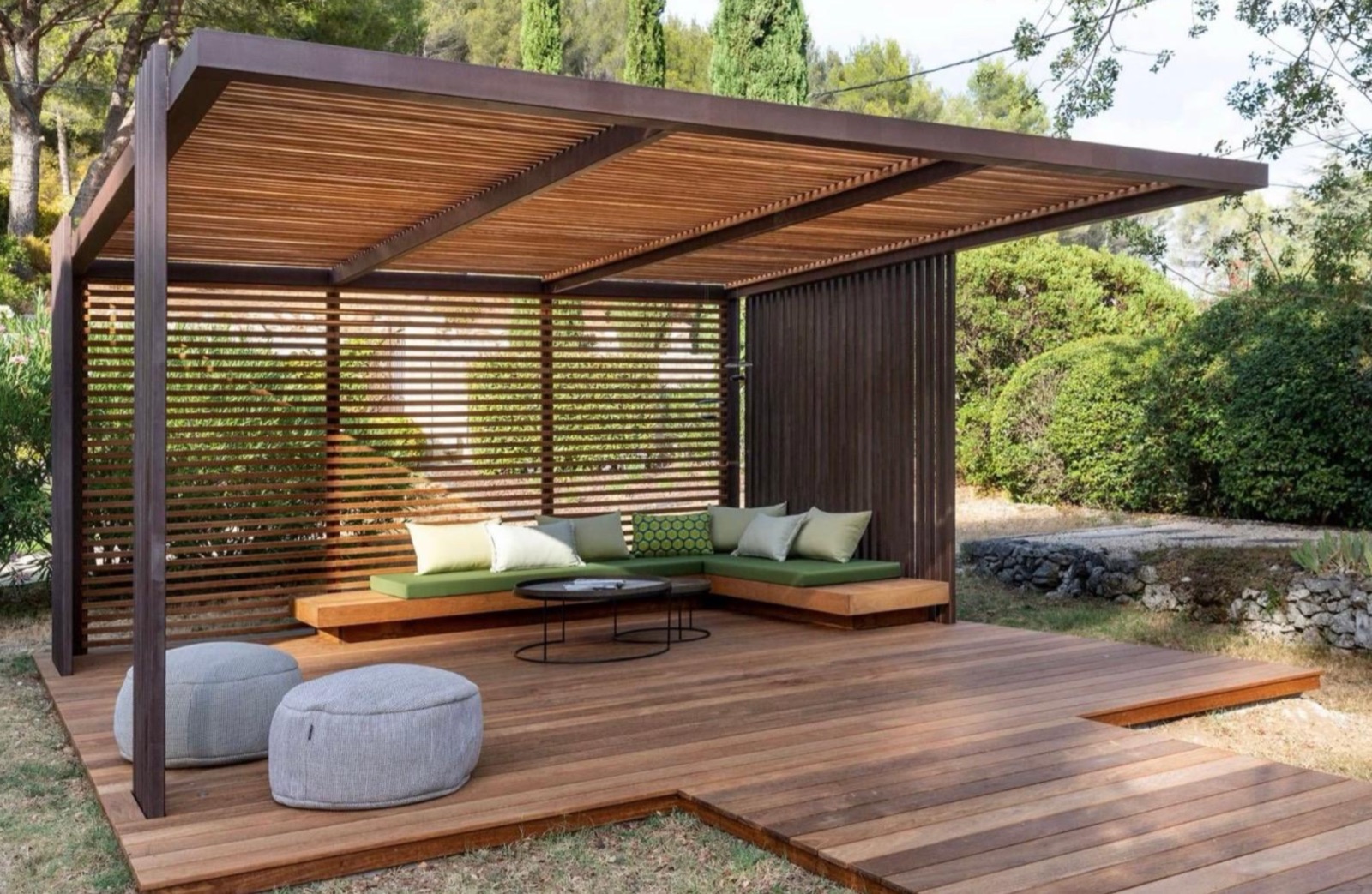 Timber pergola with slatted roof over a hardwood deck